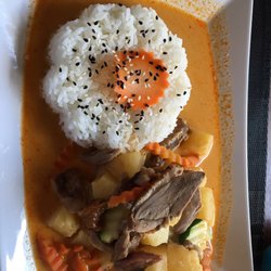 Ploy Thai - Sauteed veggies and pineapple with duck and white rice in a slightly spicy curry sauce.