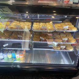 Case of pies at ordering counter Case of pies at ordering counter