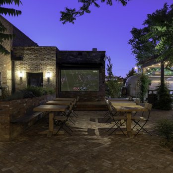 Abby's Highway 40 - Brick patio garden at night. - Dive Bars Near Me - Reno, Nevada