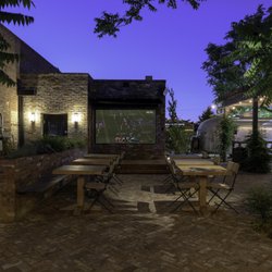 Abby's Highway 40 - Brick patio garden at night.