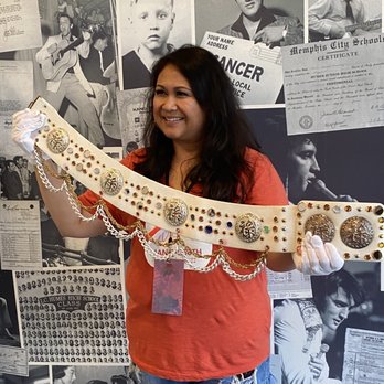 Graceland - My cousin Emily holding Elvis Presley's actual belt! Only available on the VIP Tour. - Museums Near Me - Memphis, Tennessee Graceland - My cousin Emily holding Elvis Presley's actual belt! Only available on the VIP Tour. - Museums Near Me - Memphis, Tennessee