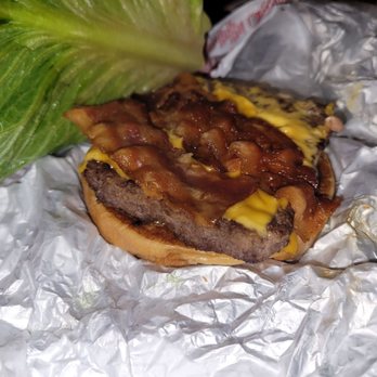 Wendy's - The inside of the bacon deluxe burger. 3 slices of bacon and a slice of cheese. - Fast Food Near Me - San Diego, California Wendy's - The inside of the bacon deluxe burger. 3 slices of bacon and a slice of cheese. - Fast Food Near Me - San Diego, California