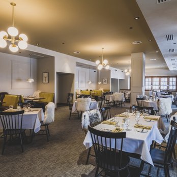 Fern and Feather - a dining room with tables and chairs - Wine Bars Near Me - Donnelly, Idaho