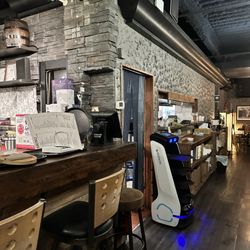 Green Leaf Cafe - Cozy interior with service robot