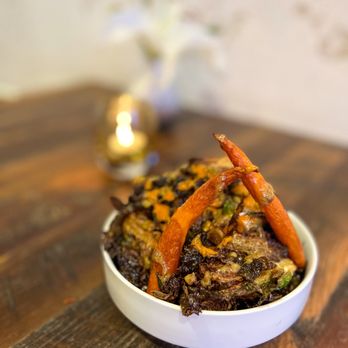Urban Kitchen - a bowl of food on a wooden table - New American Near Me - Bozeman, Montana Urban Kitchen - a bowl of food on a wooden table - New American Near Me - Bozeman, Montana