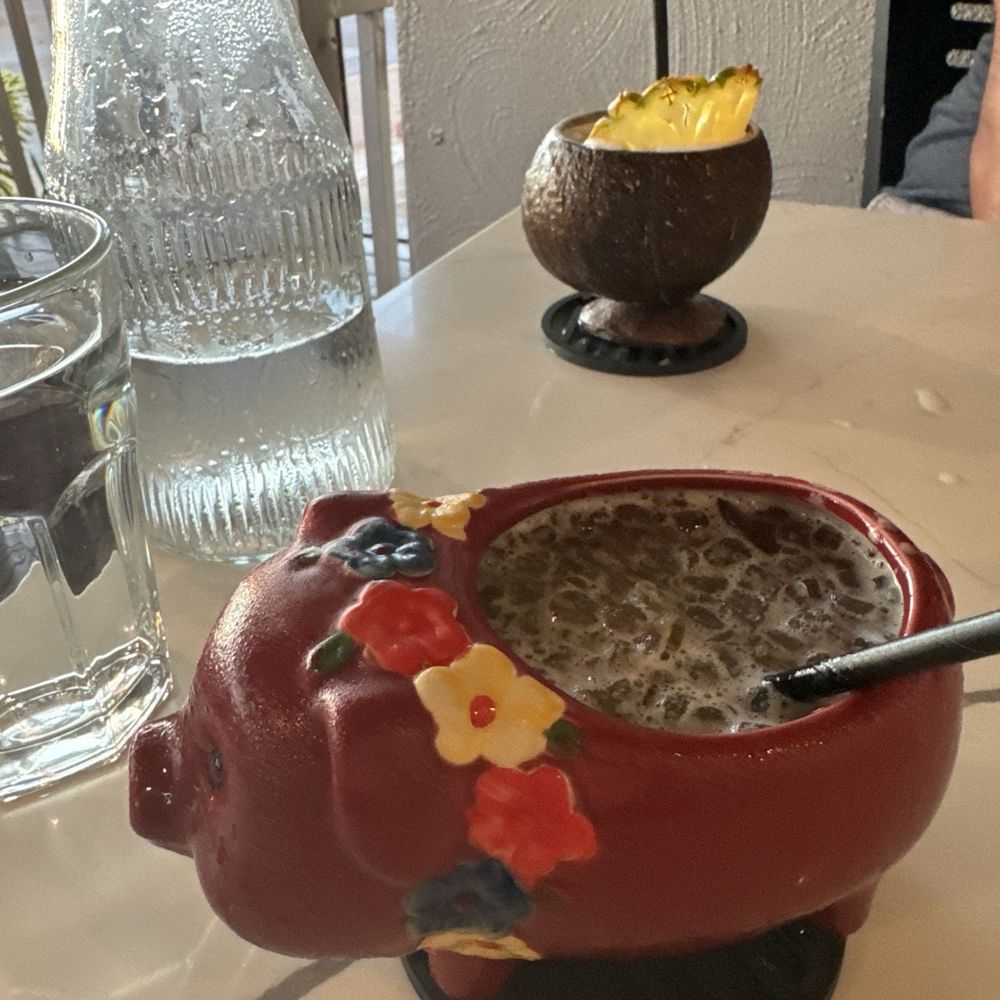 Coco Deck - Babe on vacation (pig glass) and horchata colada (coconut cup) - Mexican Near Me - Lahaina, Hawaii