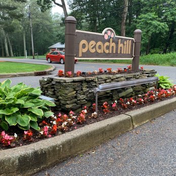 Mr. Landscape - a bench in front of a sign that reads peach hill - Landscaping Near Me - Chestnut Ridge, New York Mr. Landscape - a bench in front of a sign that reads peach hill - Landscaping Near Me - Chestnut Ridge, New York