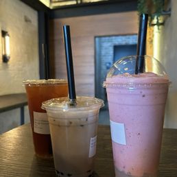 (Left to right) mango passion fruit tea, classic milk tea with boba , strawberry with lychee boba (Left to right) mango passion fruit tea, classic milk tea with boba , strawberry with lychee boba