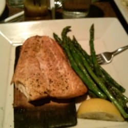 O'Charley's Restaurant & Bar - Cedar smoked salmon and asparagus with a salad best salmon I've ever had