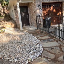Lee Sprinkler Drainage - Walk way added and retaining walls built. It feels like the garage is finally finished.