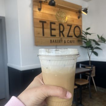 Terzo Bakery and Cafe - Iced vanilla latte with oat milk topped with coquito cream - Bakeries Near Me - Chula Vista, California