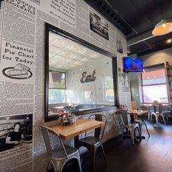 Brownstone Pancake Factory - Newspaper article wall paper and a side dining room