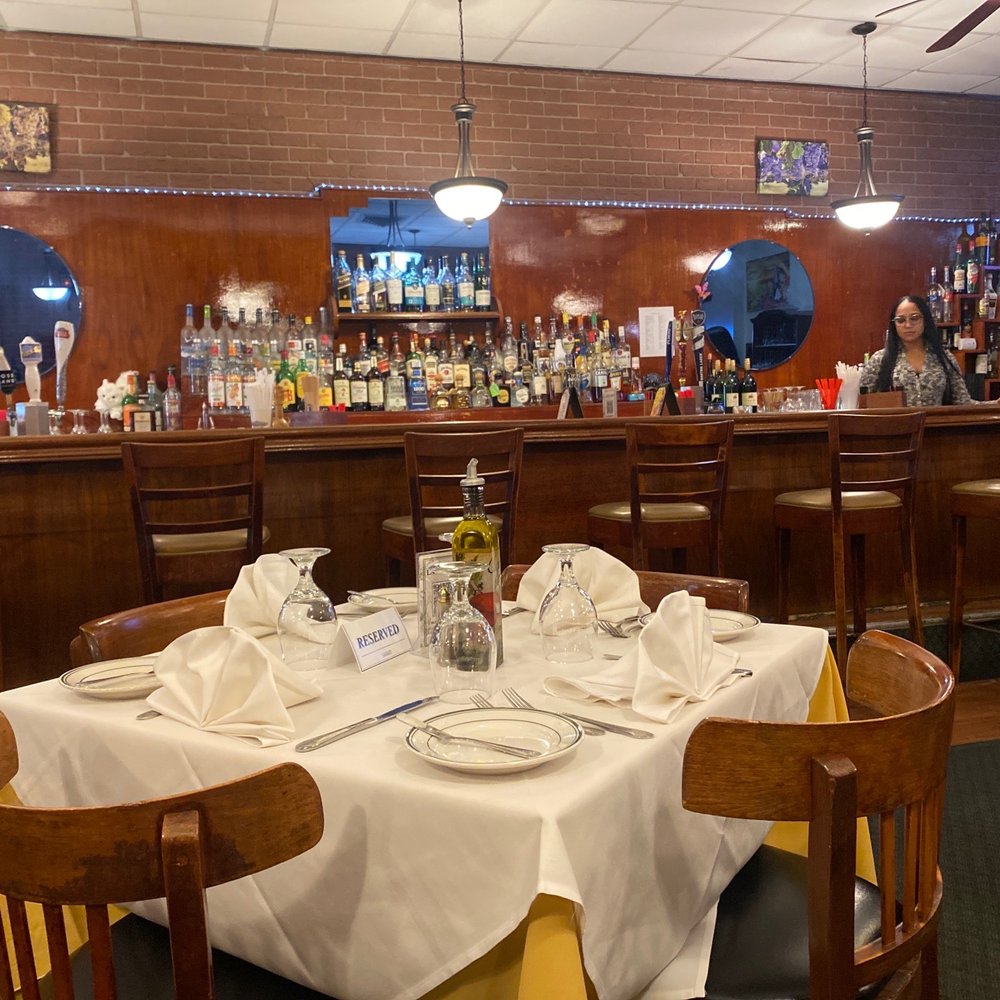 La Fiamma - a table set for a meal - Italian Near Me - Harrison, New Jersey La Fiamma - a table set for a meal - Italian Near Me - Harrison, New Jersey
