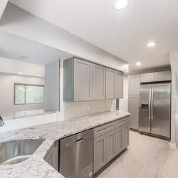 Stetor Remodeling - Mount Washington kitchen remodel featuring a wide cutout opening to the living room that improves sightlines and creates a co...