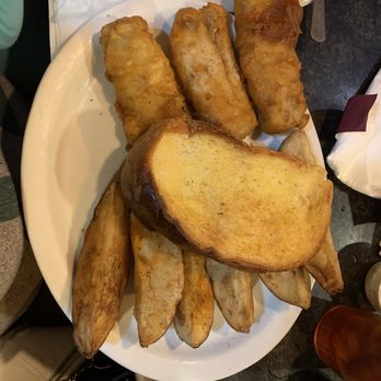 Nikola's Restaurant - Cod dinner with potato wedges and garlic bread - Barbeque Near Me - Southfield, Michigan Nikola's Restaurant - Cod dinner with potato wedges and garlic bread - Barbeque Near Me - Southfield, Michigan