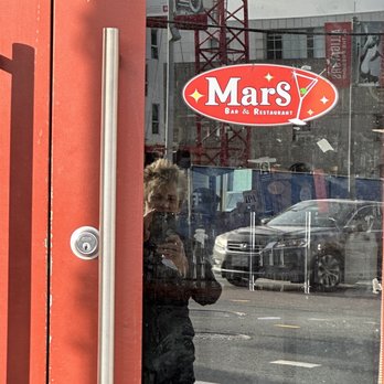Mars Bar & Restaurant - a reflection of a child in the window - Bars Near Me - San Francisco, California