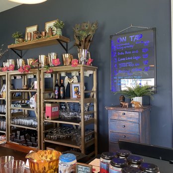 Eastern Front - a bar with shelves of drinks and snacks - Breweries Near Me - Mattituck, New York