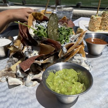 Hay's Place - Tin Can Nachos complete with sides and queso blanco sauce. - Mexican Near Me - Pebble Beach, California Hay's Place - Tin Can Nachos complete with sides and queso blanco sauce. - Mexican Near Me - Pebble Beach, California