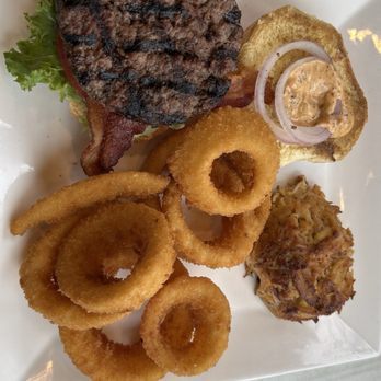 Water Street Grille - Bacon burger with crab cake with onion rings - Seafood Near Me - Yorktown, Virginia Water Street Grille - Bacon burger with crab cake with onion rings - Seafood Near Me - Yorktown, Virginia