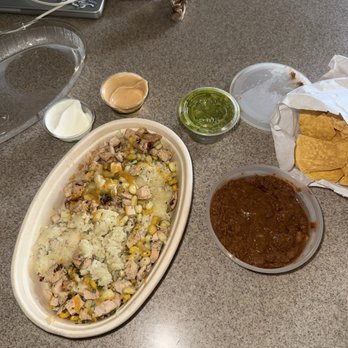 Luna's Tex Mex Cantina - Chicken bowl with a side of refried pinto beans, guacamole chips, salad dressing, which taste like spicy mayo, and sour cream - Mexican Near Me - Honolulu, Hawaii Luna's Tex Mex Cantina - Chicken bowl with a side of refried pinto beans, guacamole chips, salad dressing, which taste like spicy mayo, and sour cream - Mexican Near Me - Honolulu, Hawaii