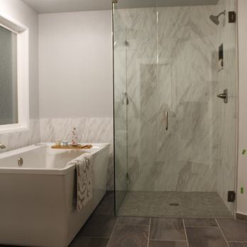 Landin Construction - a bathroom with a walk in shower - General Contractors Near Me - Tukwila, Washington Landin Construction - a bathroom with a walk in shower - General Contractors Near Me - Tukwila, Washington