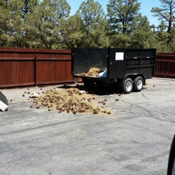 Whispering Pines Estates - This is how some residents treat the wonderfully clean disposal area. Just dump their yard waste right behind the trailer.