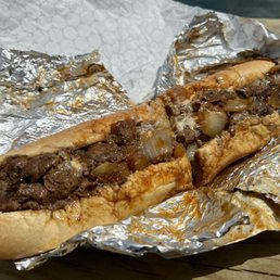 Large steak with white American, sautéed onions, red hots and hot sauce. Large steak with white American, sautéed onions, red hots and hot sauce.