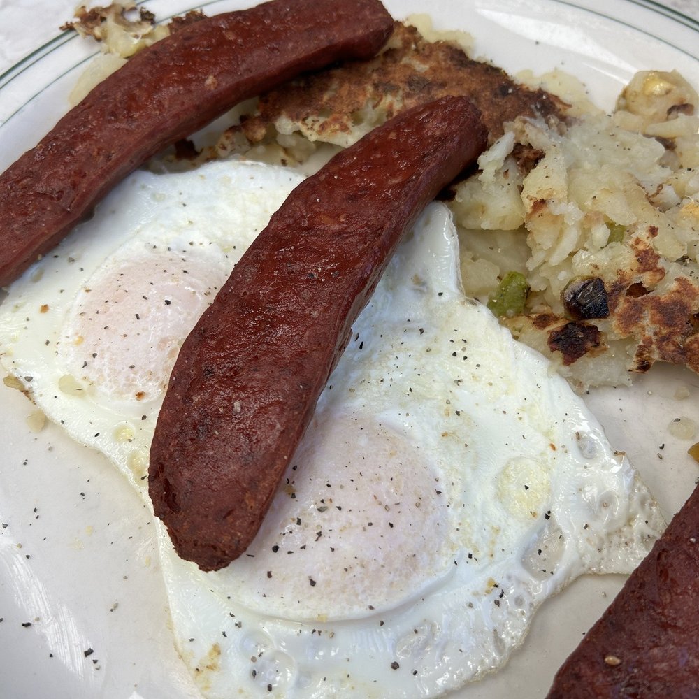 Eggs over easy/beef sausage Eggs over easy/beef sausage