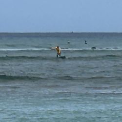 Shaka Surfing Academy - That's us with Matt in the ocean, learning to surf for the first time in our lives