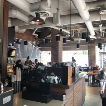 Starbucks - people sitting at tables in a coffee shop - Coffee & Tea Near Me - Vancouver, British Columbia