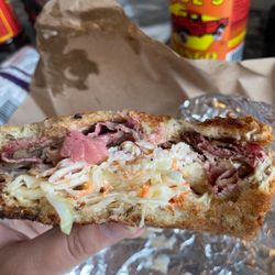 Marsh Brothers Deli - 50/50 Sandwich - Wood fired Pastrami, Wood fired Turkey, Thousand Island Sauce, Cole Slaw on Rye Bread