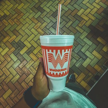 Whataburger - a person holding a cup with a straw - Burgers Near Me - El Paso, Texas