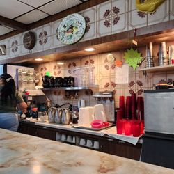 Counter short with adorable server in the background.