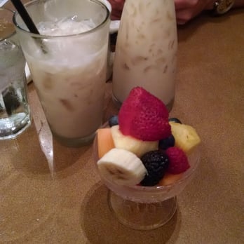Tweet - The chai tea latte and a bowl of fruit at Tweet - New American Near Me - Chicago, Illinois