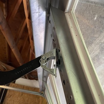 R & E Garage Doors - Before: Bracket also had torn off. - Garage Door Services Near Me R & E Garage Doors - Before: Bracket also had torn off. - Garage Door Services Near Me