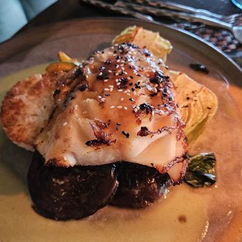 Six Seven Restaurant - Black cod on coconut crusted rice cake, bok choy and shiitake mushroom. - New American Near Me - Seattle, Washington Six Seven Restaurant - Black cod on coconut crusted rice cake, bok choy and shiitake mushroom. - New American Near Me - Seattle, Washington