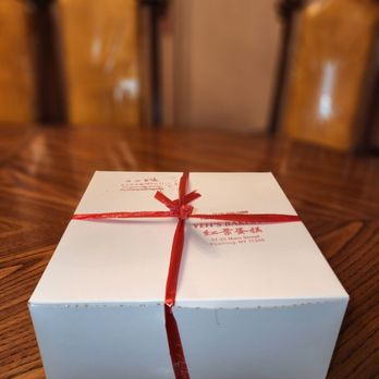 Yeh's Bakery - a white box with a red ribbon - Bakeries Near Me - Flushing, New York