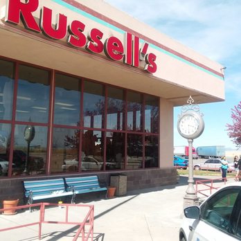 Russell's Route 66 Diner - Bench, clock and tree. - American Near Me - Springer, New Mexico