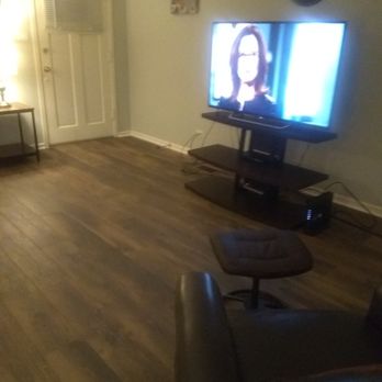 Majestic Flooring - a living room with wood floors and a flat screen tv - Flooring Near Me - Oak Lawn, Illinois