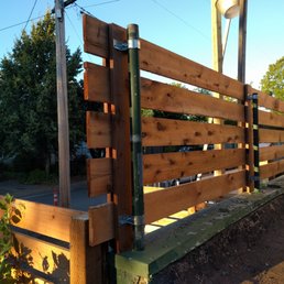 Husky Fence ingeniously used the existing posts and tied the new fence into them. Great work! Husky Fence ingeniously used the existing posts and tied the new fence into them. Great work!
