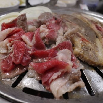 Stadium Camellia Restaurant - a close up of meat on a grill - Barbeque Near Me - Honolulu, Hawaii Stadium Camellia Restaurant - a close up of meat on a grill - Barbeque Near Me - Honolulu, Hawaii