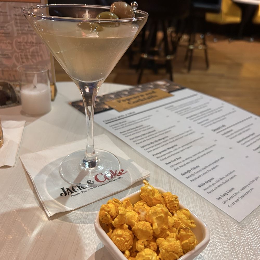 Dirty vodka martini with Cajun popcorn Dirty vodka martini with Cajun popcorn