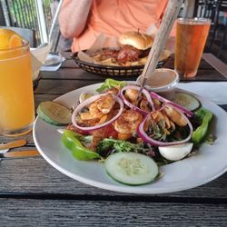 The Monkey Bar - Fish sandwich and a salad with Cajun grilled shrimp, ice cold draft beers
