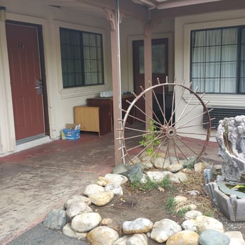 Mother Lode Motel - Old hotel furniture left outside and sad garden. - Hotels Near Me - Placerville, California Mother Lode Motel - Old hotel furniture left outside and sad garden. - Hotels Near Me - Placerville, California