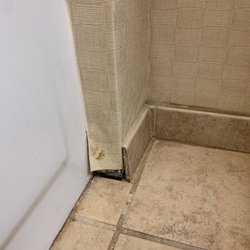 Bathroom wall is peeling and un kept