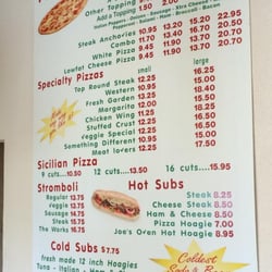 Joe's Pizza - Menu board posted in the restaurant.