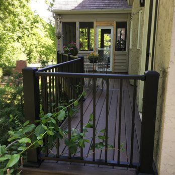 Outdoor Solutions Inc - a deck with railings - General Contractors Near Me - Prior Lake, Minnesota