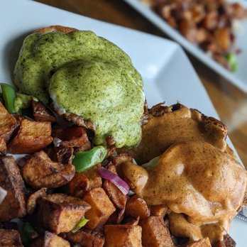 Dundee's Bar and Grill - Eggs Benedict two ways! Pesto Sauce with Italian sausage and Chipotle Sauce with pork carnitas. Divine! - Breakfast & Brunch Near Me - Seaside, Oregon