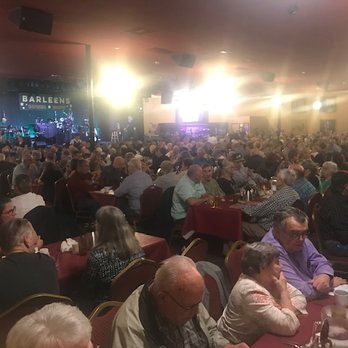 Barleens Dinner Show - Partial view of the large dining area at Barleens with the stage in the background. - Dinner Theater Near Me - Apache Junction, Arizona