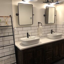 a bathroom with double sinks